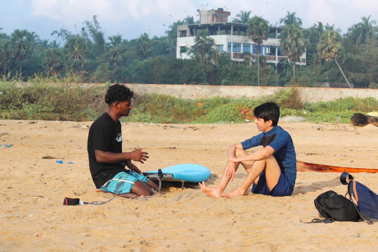 One-on-one coaching on the sand before a lesson