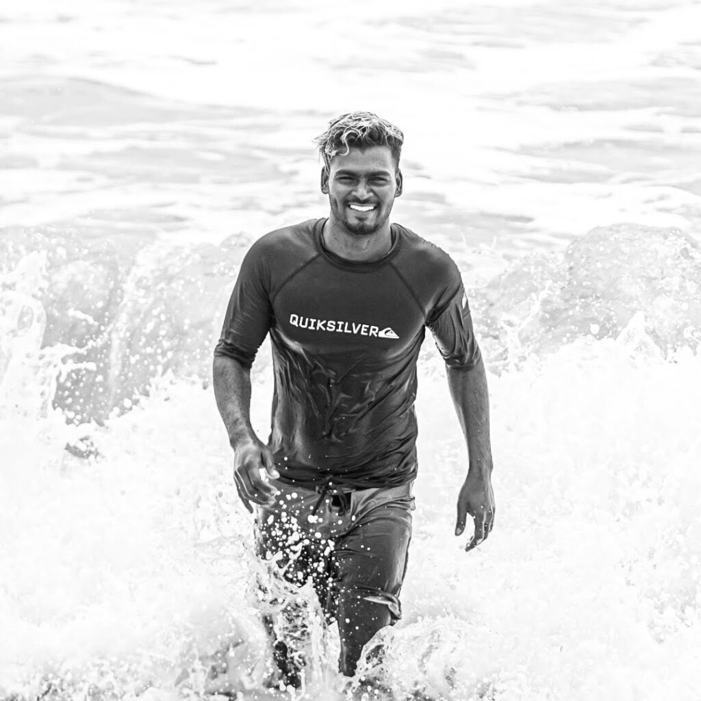 Vicky, founder and head instructor, walking out of the surf